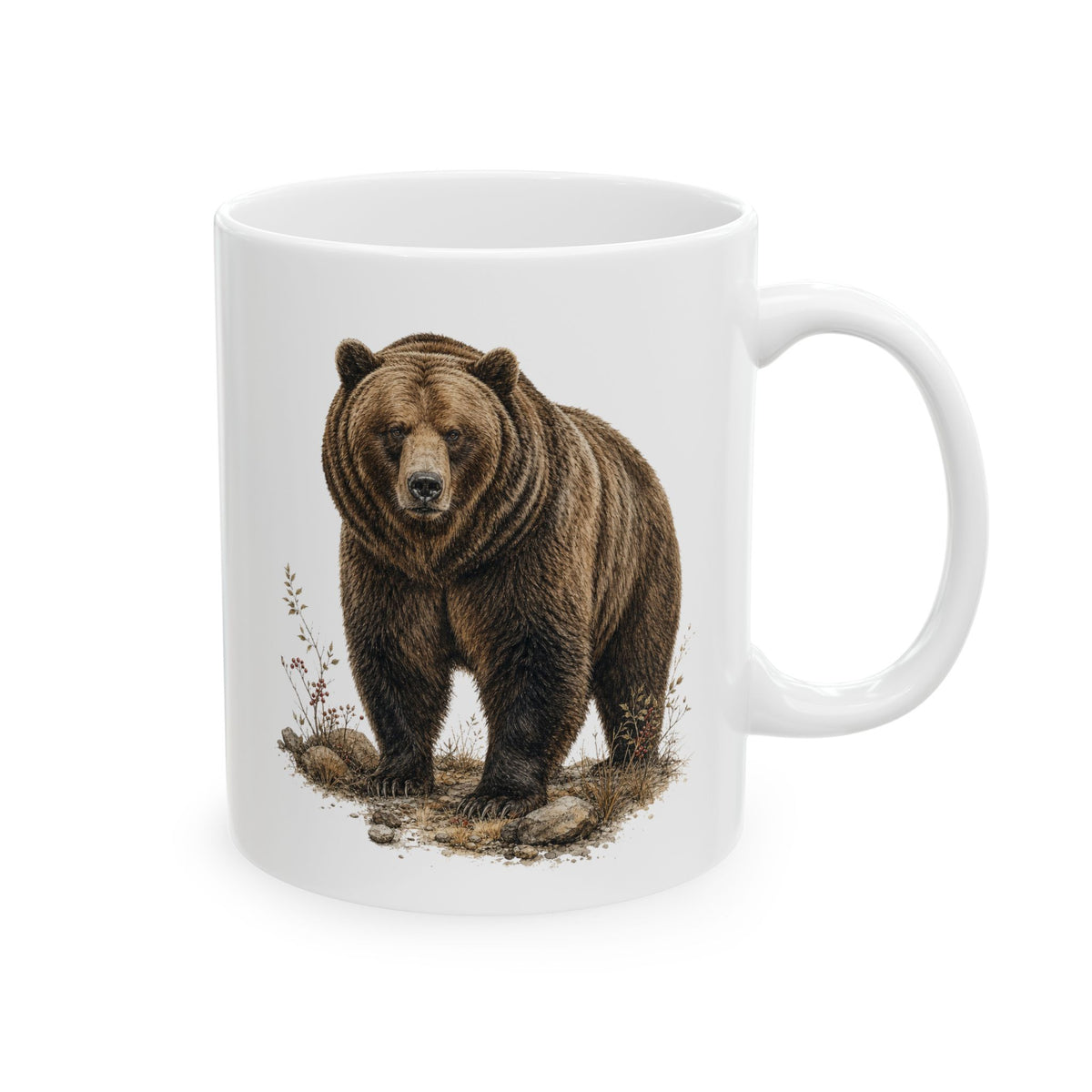 Rustic ceramic coffee mug with a detailed brown bear portrait surrounded by grasses and small woodland plants in warm brown and neutral tones, creating a vintage wildlife look inspired by mountain cabins and wilderness decor.